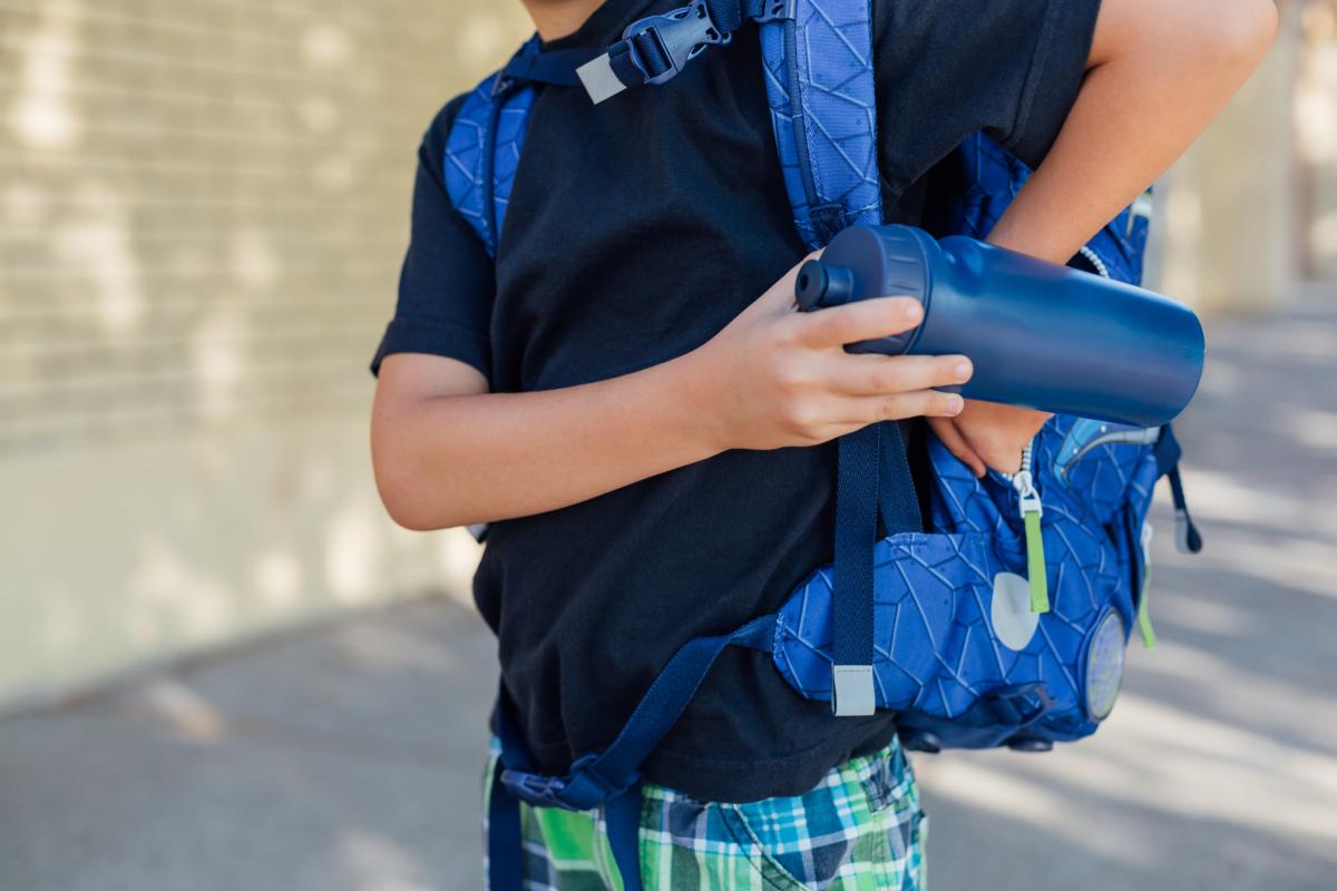 schoolboy with water bottle.