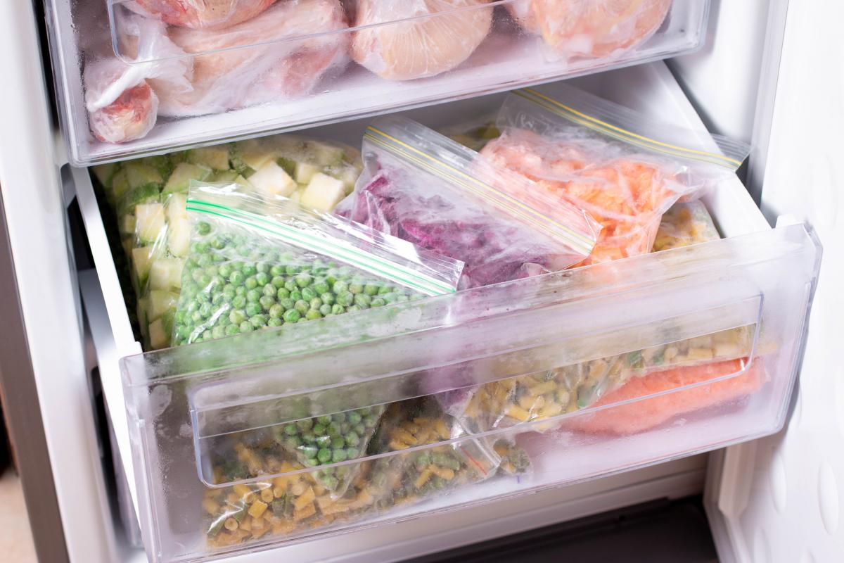Freezer with bags of frozen vegetables