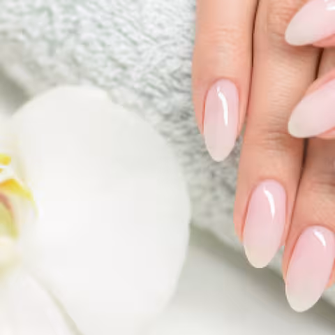 Manicured nails on a towel