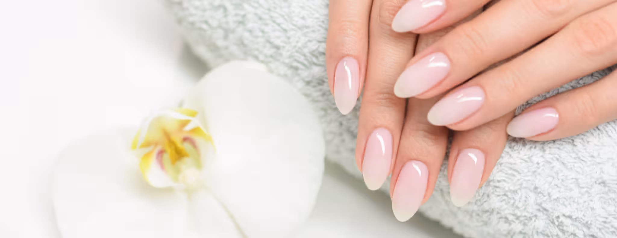 Manicured nails on a towel