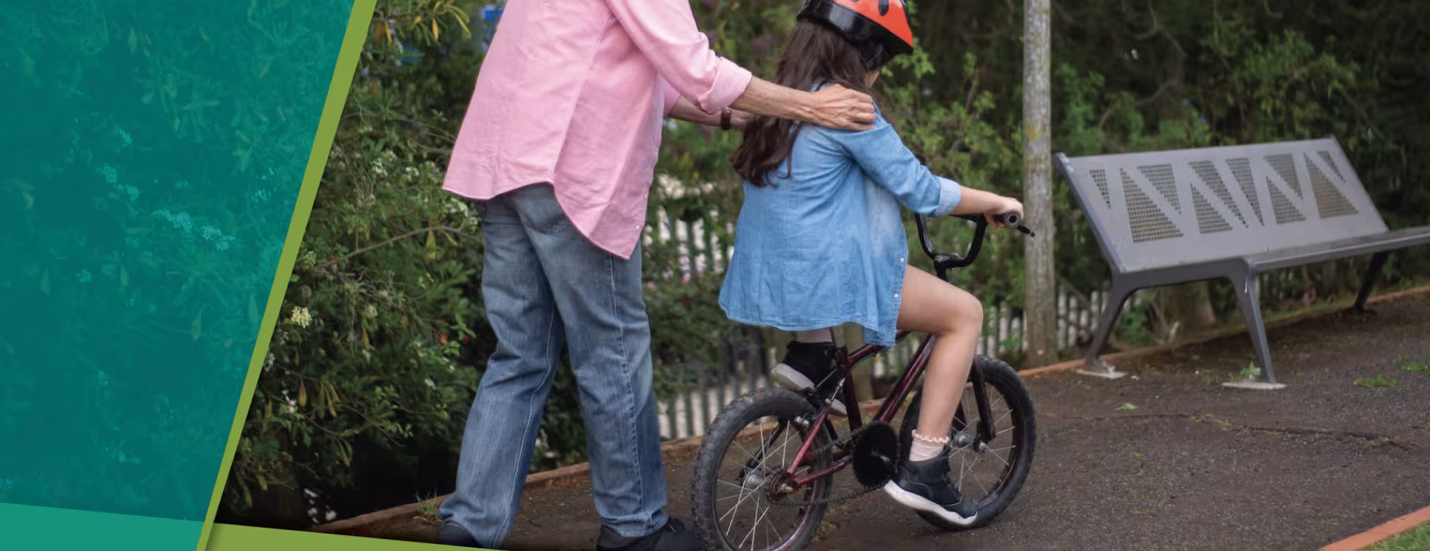 Older adult pushing child on a bicycle, 2024-2028 WDGPH Strategic Plan