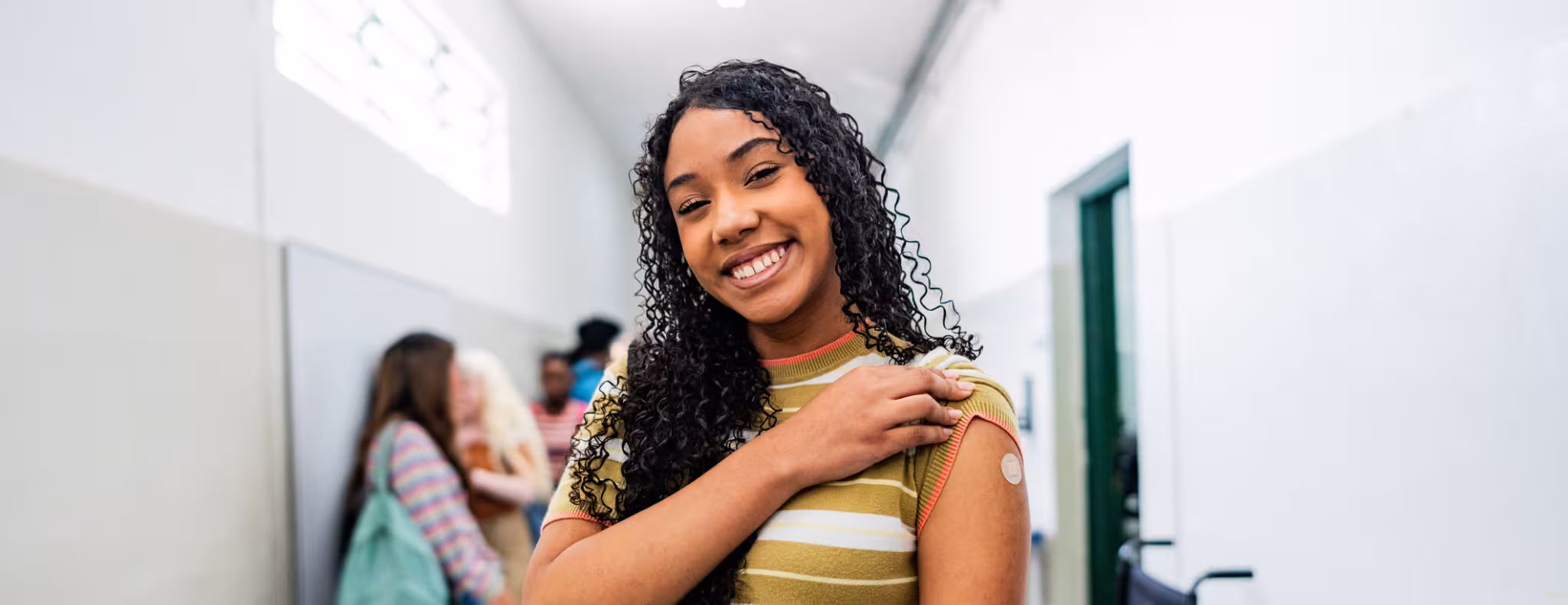Portrait of a teenager student after taking vaccine at school