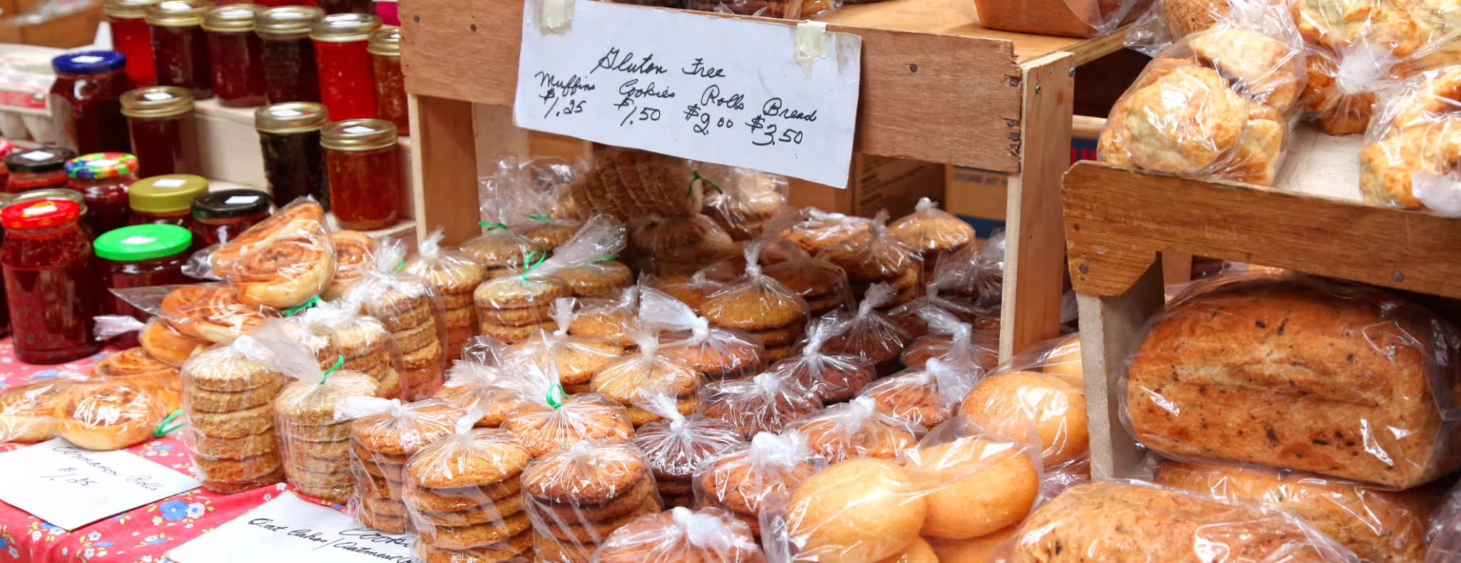 A spread of baked goods and jam at the farmers market